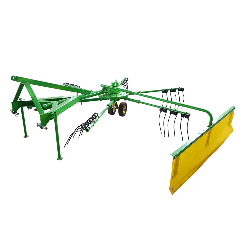 Vilkdamas šieno grėblį sukamu šieno sukamu grėbliu